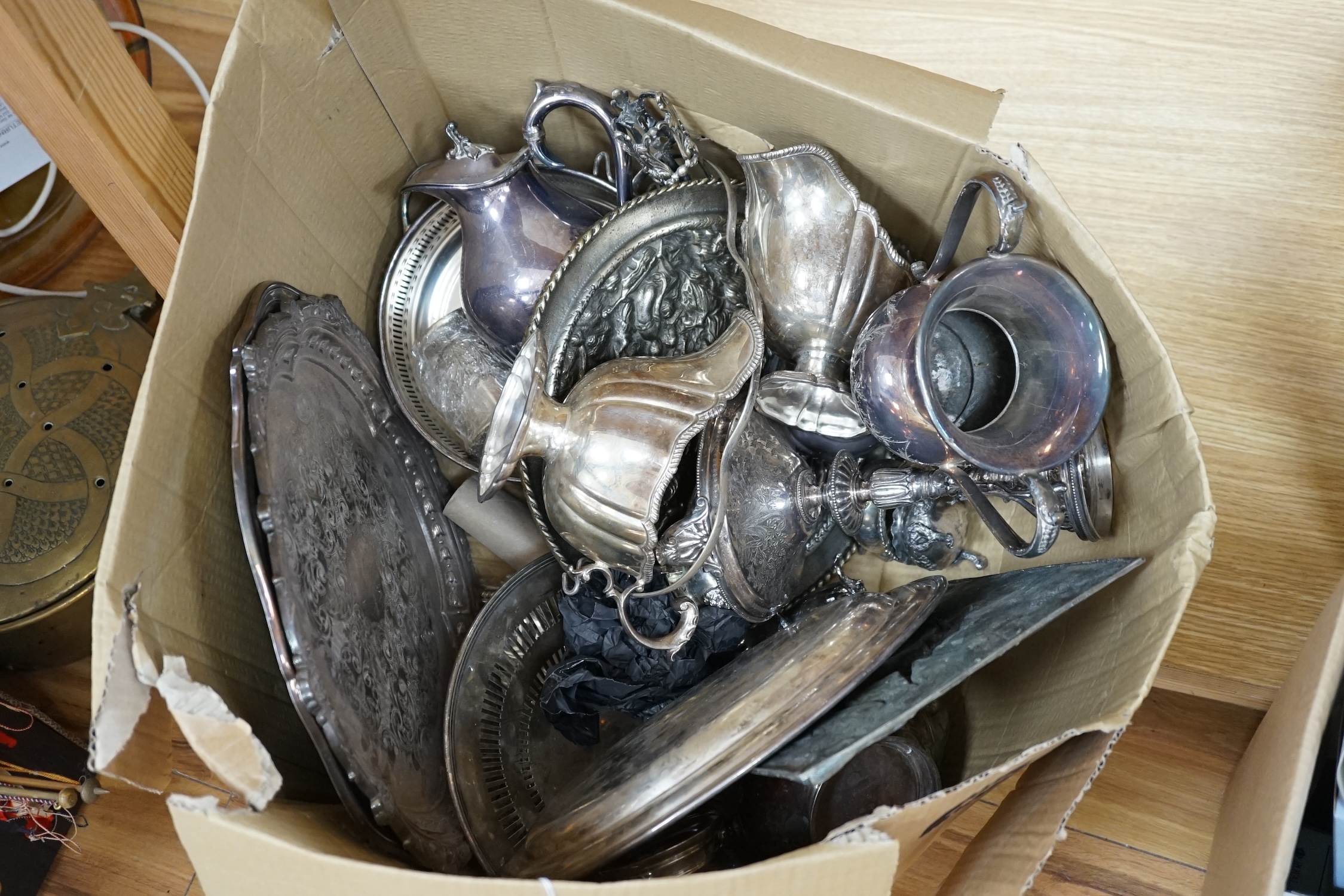 A quantity of silver plate to include a twin handled trophy, salvers and an embossed plaque depicting deer. Condition - varies, poor to fair